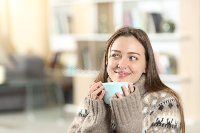 Happy Teen Drinking Coffee and Dreaming at Home in Winter Stock Photo ...