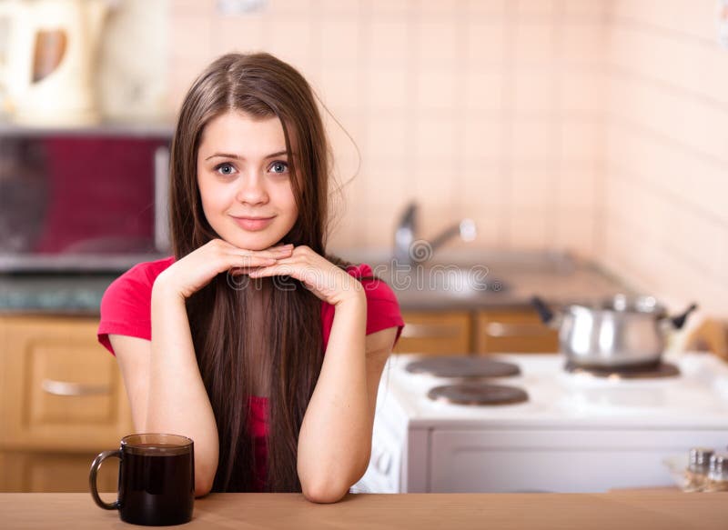 Happy Teen Girl Drinking Coffee At Home Stock Photo Image