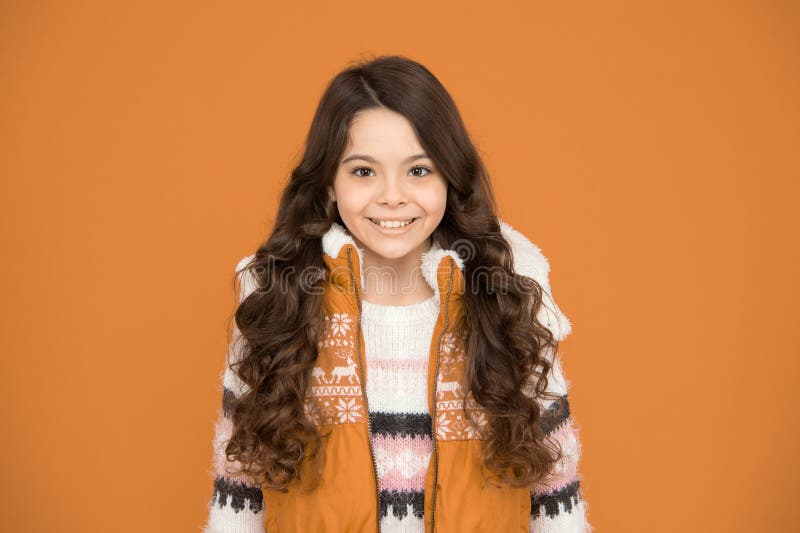 Happy Teen Girl with Long Curly Hair Wear Puffer Waistcoat and Sweater with  Christmas Patterns, Winter Clothes Stock Image - Image of childhood,  fashion: 200836531