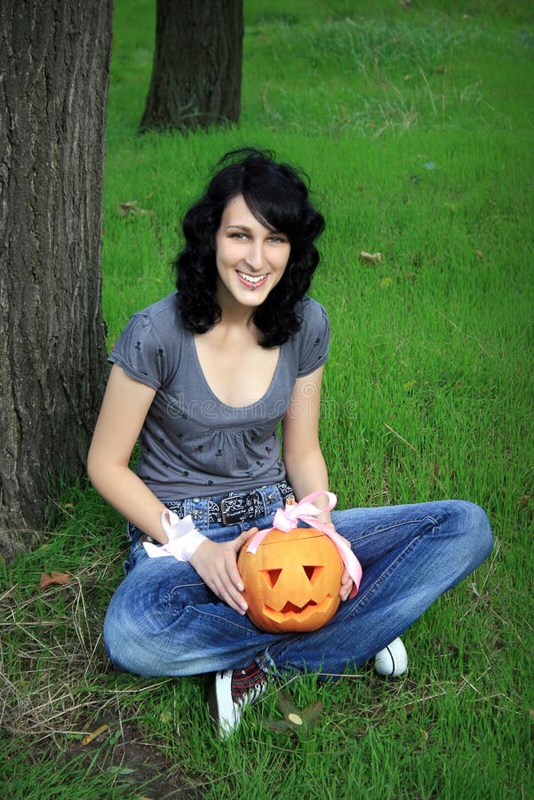 Happy teen with pumpkin stock photos Happy teen with pumpkin stock photos