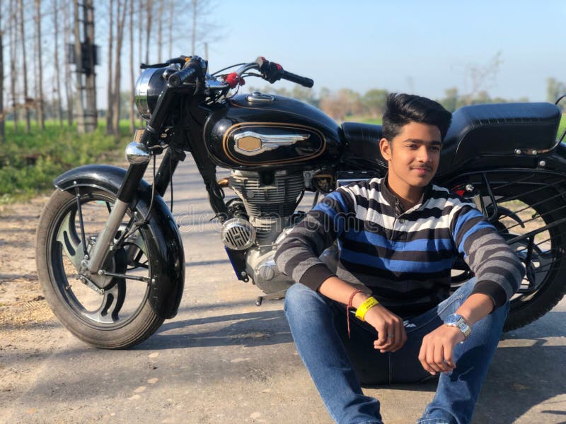 Image of Handsome Serious Indian Asian Young Man Biker On Bike Outdoors At  The Forest Field Looking Aside-LK653120-Picxy