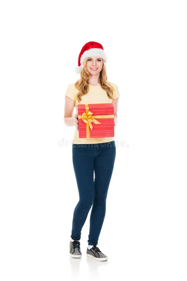 Happy teenage girl posing in a Christmas hat on white royalty free stock images Happy teenage girl posing in a Christmas hat on white royalty free stock images