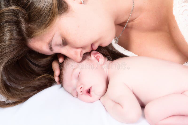 Happy and tender moment between a mother and her 11 days old newborn baby. Happy and tender moment between a mother and her 11 days old newborn baby