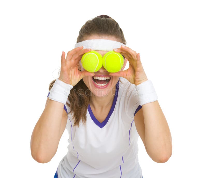 Happy Tennis Player Holding Balls in Front of Eyes Stock Photo Image