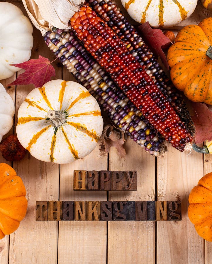 Happy Thanksgiving Text on Chalkboard Bordered with Pumpkins and Corn ...