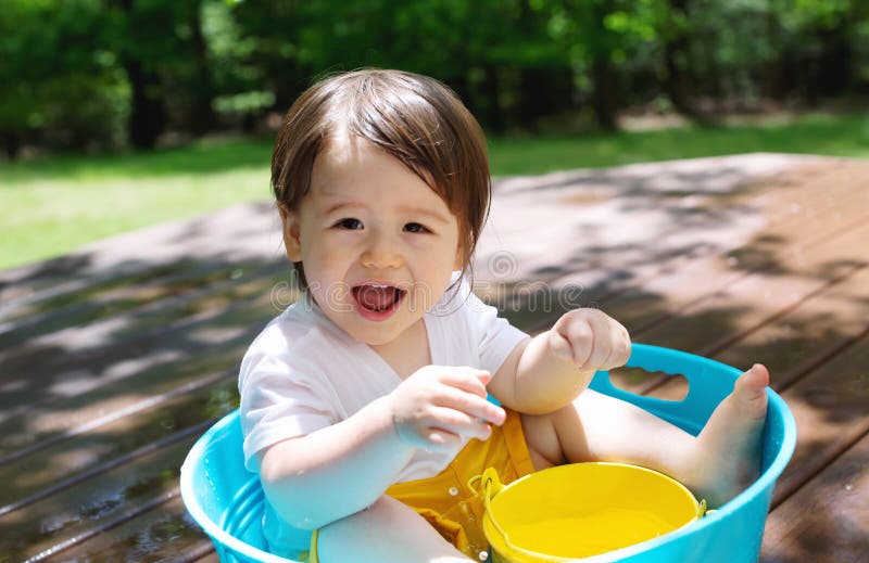 Young toddler boy playing with water royalty free stock image Young toddler boy playing with water royalty free stock image