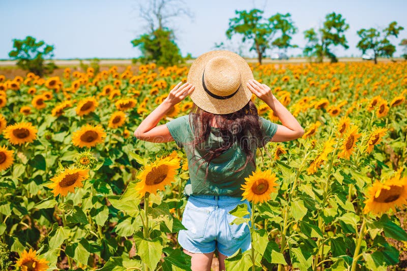 Young Woman Enjoying Nature on the Field of Sunflowers. Stock Image ...