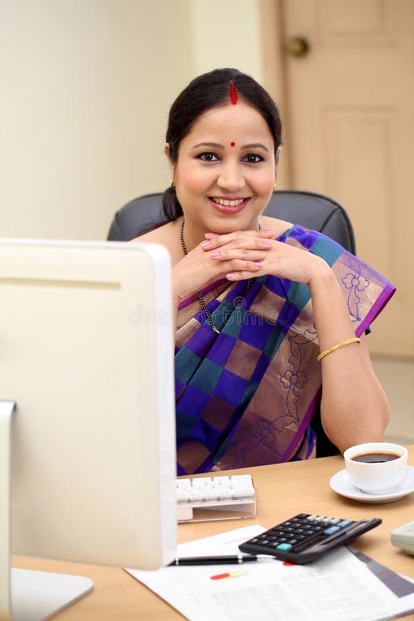 Happy Traditional Indian Business Woman At Office Desk Stock Image