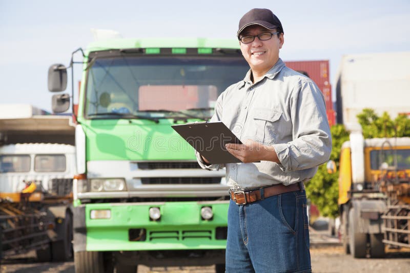 Happy truck driver writing on document
