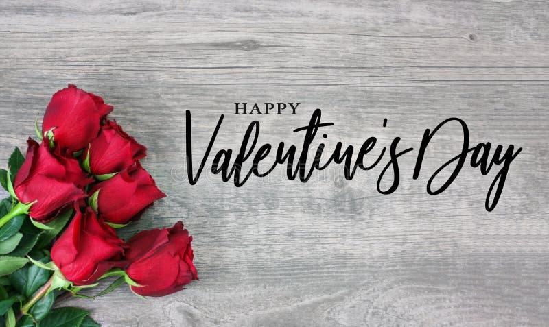 Happy Valentine`s Day Calligraphy Font Text with Beautiful Red Rose Flowers in Corner Over Light Wood Background Valentine Holiday Greeting Card Graphic Design Happy Valentine`s Day Handwriting Typography Message with Red Rose Bouquet