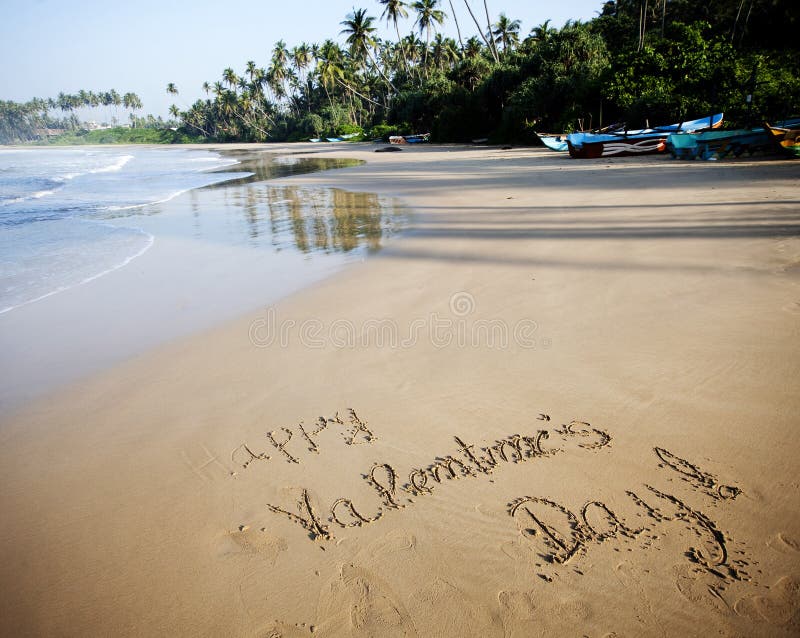 Happy Valentines day! written in sand on tropical beach. Vintage photo stock image
