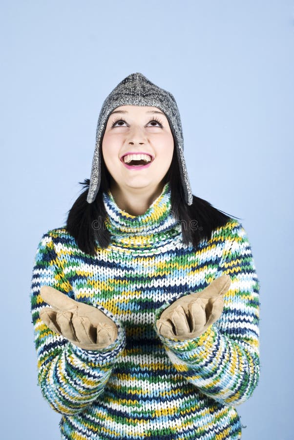 Happy winter girl looking up