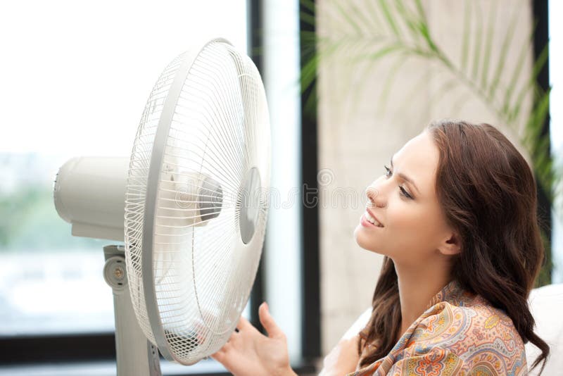 Happy woman with big fan