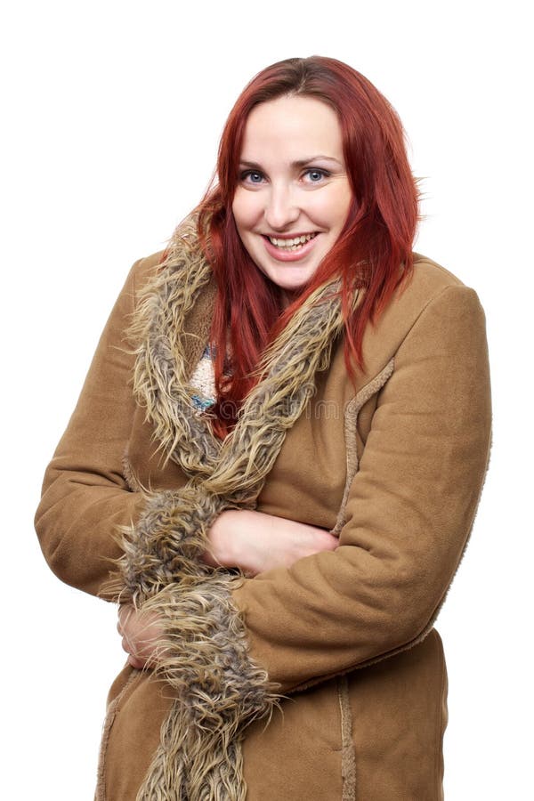 Happy woman in big winter coat royalty free stock photography Happy woman in big winter coat royalty free stock photography