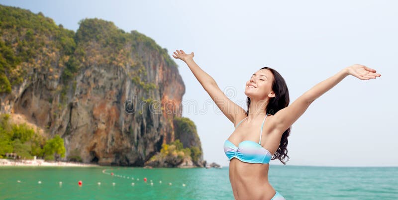 Happy woman in bikini swimsuit with raised hands royalty free stock photos Happy woman in bikini swimsuit with raised hands royalty free stock photos