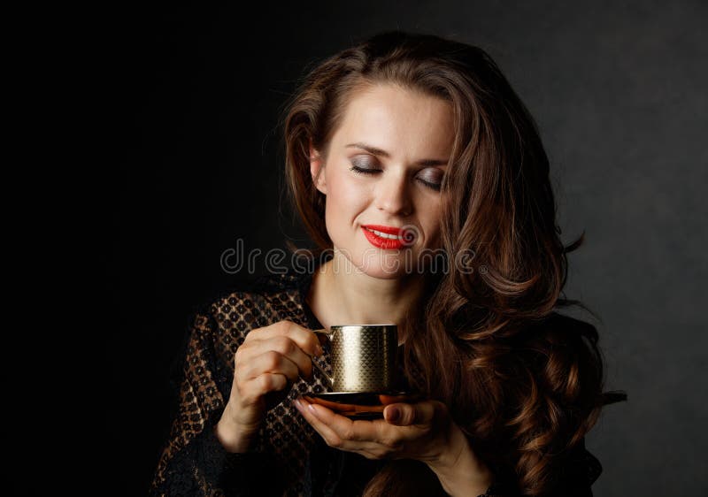 Happy Woman With Brown Hair And Red Lips Enjoying Cup Of