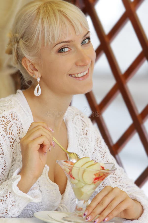 Happy woman in cafe / restaurant