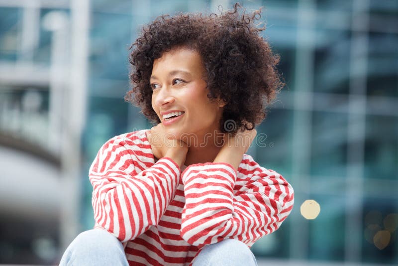 Happy woman with curly hair laughing outdoors stock images Happy woman with curly hair laughing outdoors stock images