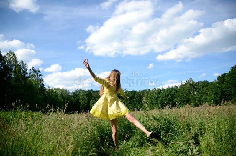 Happy woman dancing on the grass stock photography Happy woman dancing on the grass stock photography