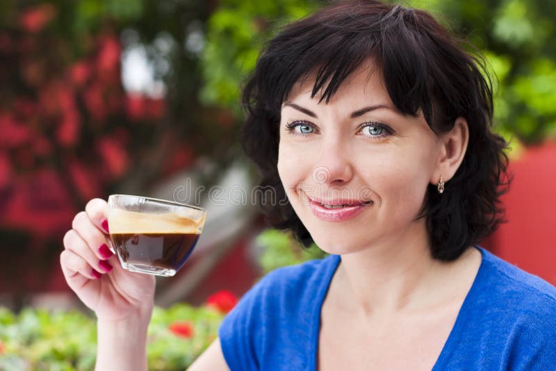 Happy woman drinking coffee