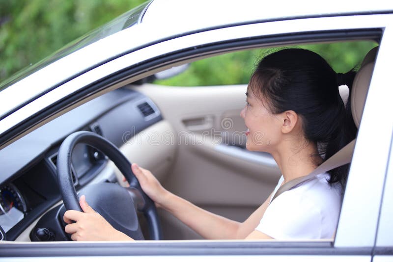 Happy woman driving car stock photos Happy woman driving car stock photos