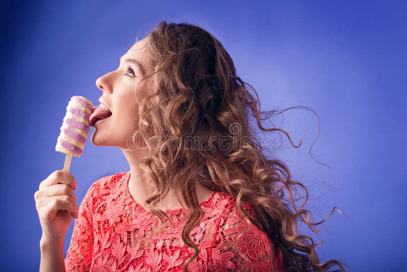 Happy woman eating ice cream royalty free stock images