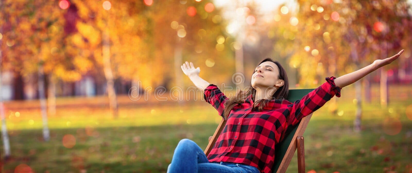 Happy Woman Enjoying Life in the Autumn on the Nature Stock Photo