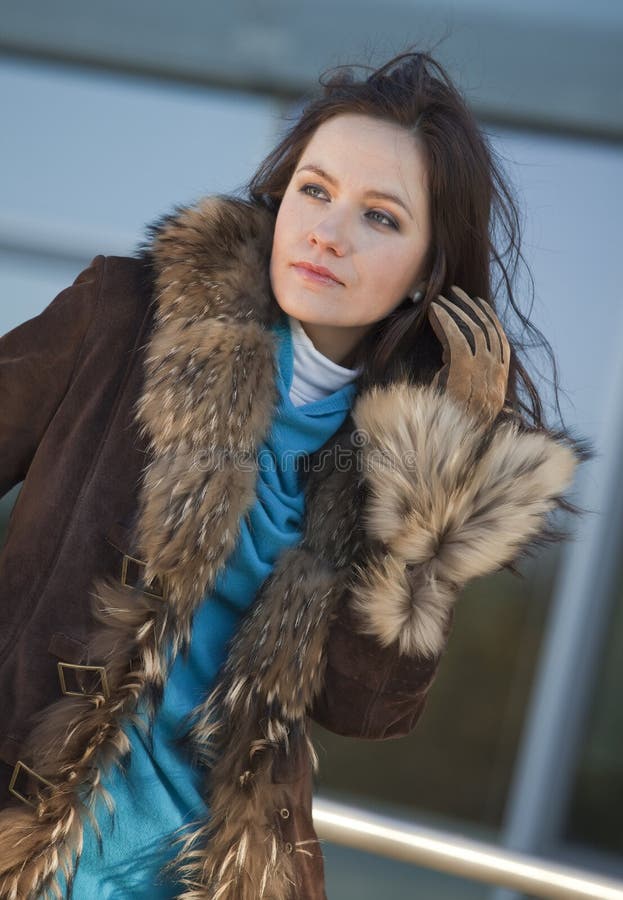 Woman with gun in coat stock photo. Image of hand, danger - 33053552