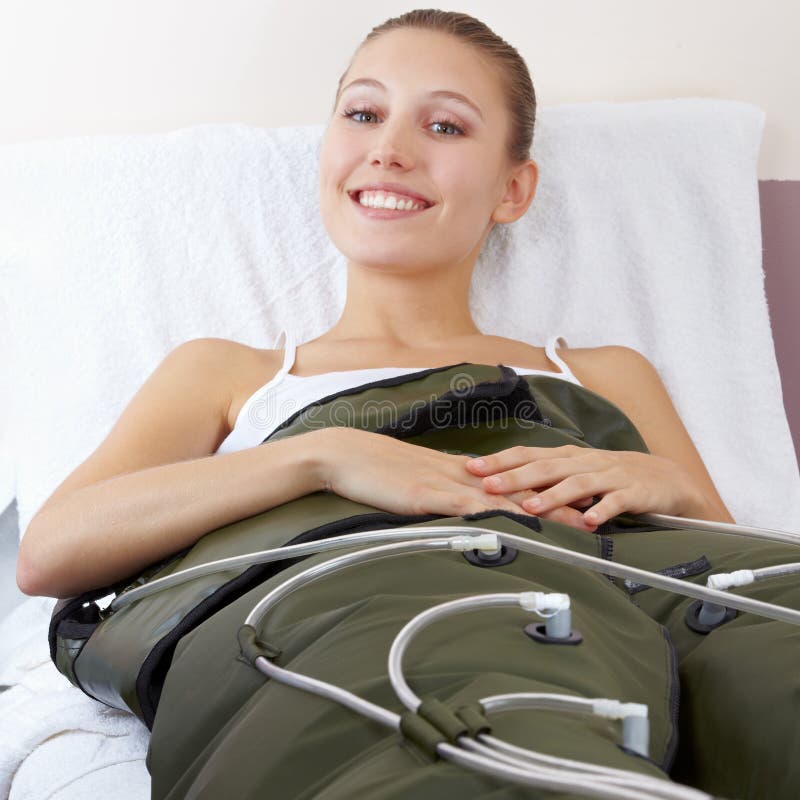 Happy woman getting massage in spa royalty free stock image