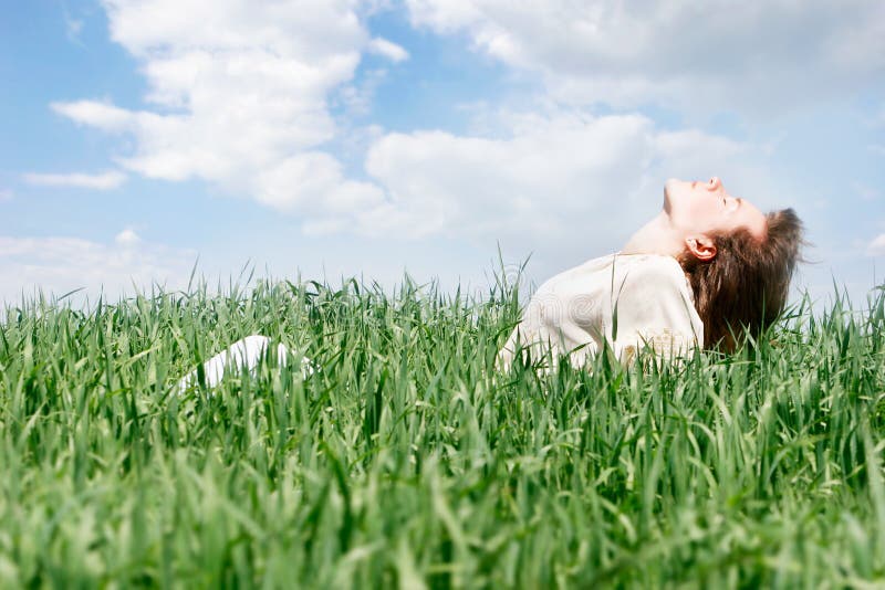 Happy woman in green grass