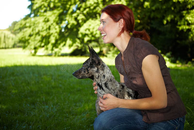 Happy woman with her dog stock photos