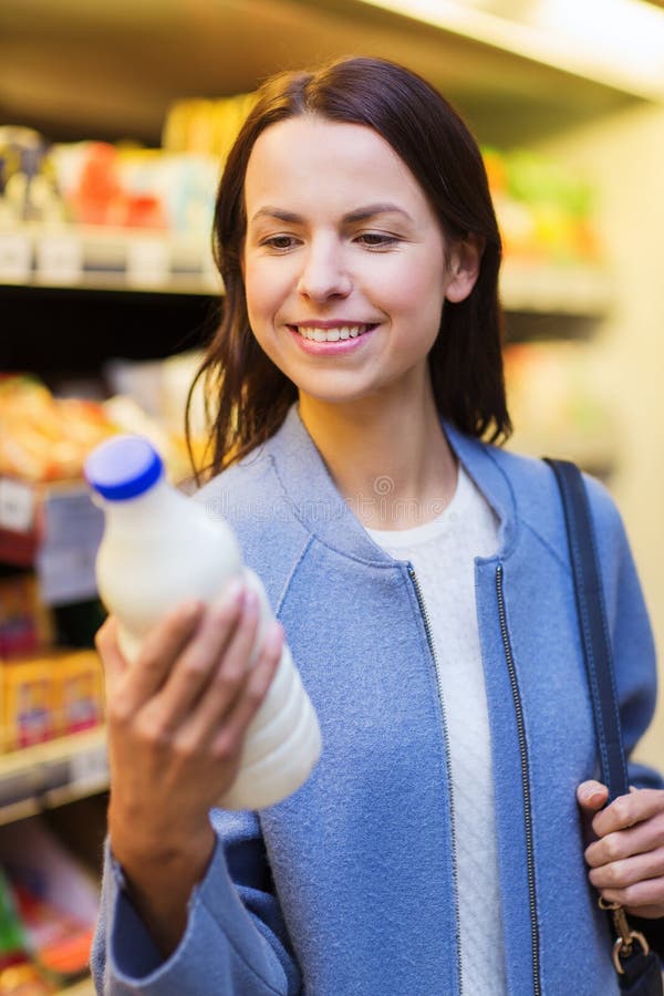 Happy Woman Holding Milk Bottle In Market Stock Photo Image Of