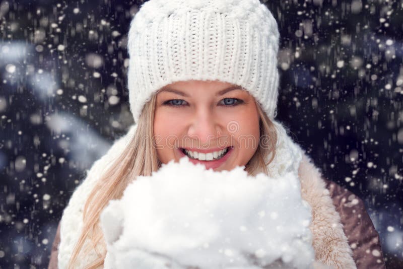 Happy woman holding snow royalty free stock images