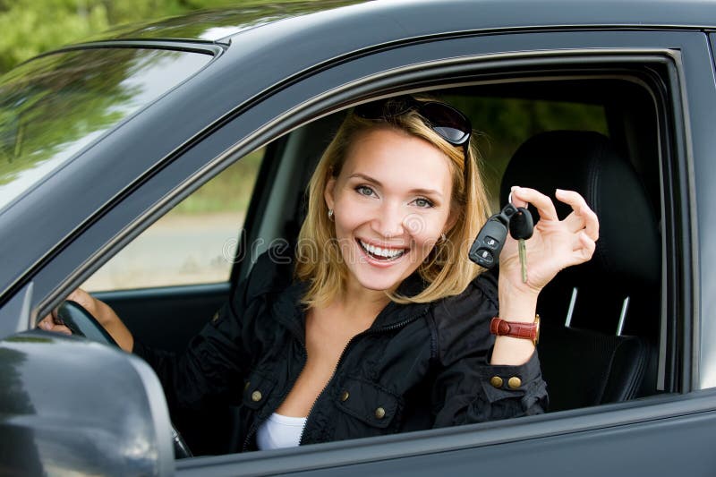 Happy woman in the new car with keys royalty free stock images Happy woman in the new car with keys royalty free stock images
