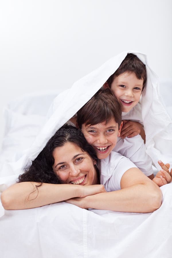 Family Time - Young Parents with Two Kids Playing Stock Image - Image ...
