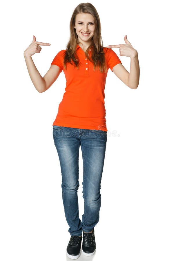 Happy woman pointing at herself standing in full length