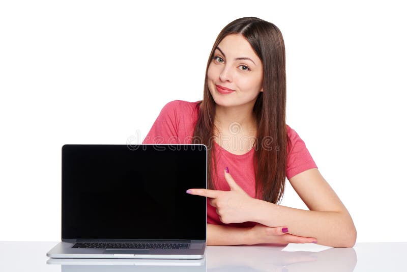 Happy woman pointing at a laptop computer screen