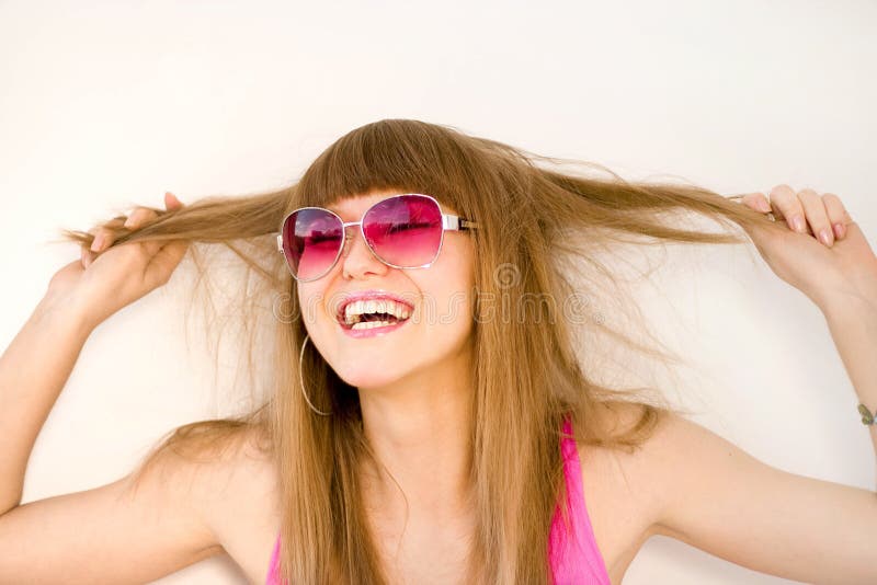 Happy woman pulling hair