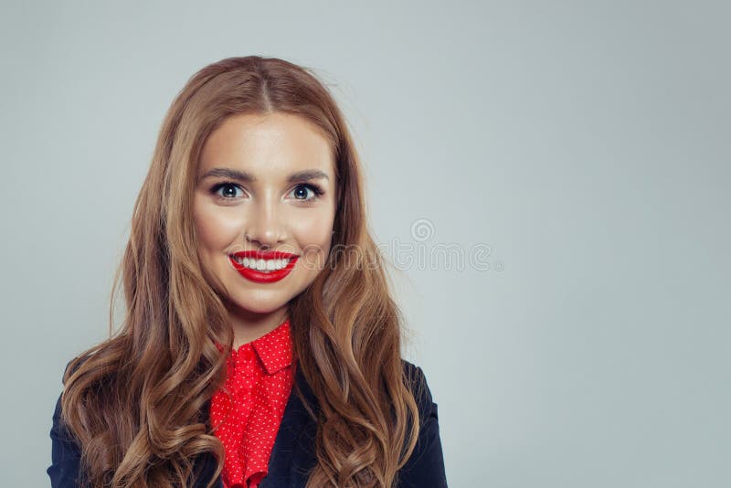 Happy woman smiling on white background. Business woman in black suit portrait