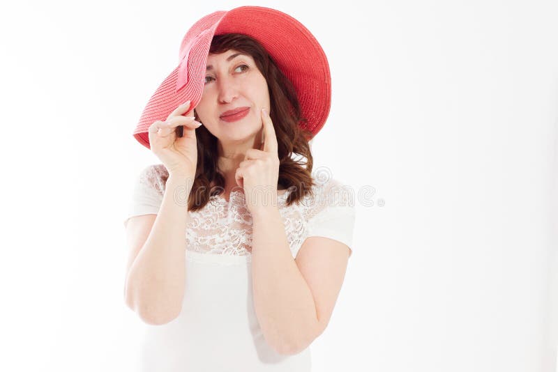 Happy woman in summer hat isolated on white background. Sun protection skin care and vacation holidays concept. Middle age female stock photography Happy woman in summer hat isolated on white background. Sun protection skin care and vacation holidays concept. Middle age female stock photography