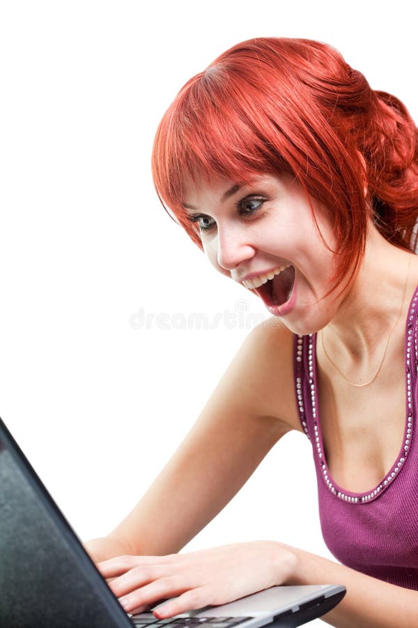Happy woman surfing internet on laptop