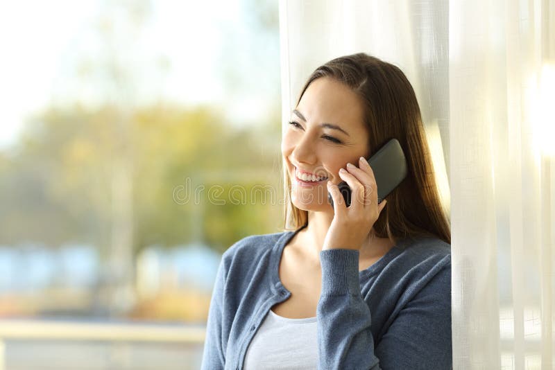 Woman Talking on Phone Standing at Home Stock Image - Image of brunette