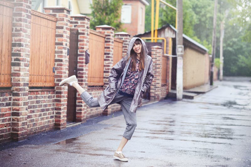 Happy woman walking in the rain royalty free stock photo Happy woman walking in the rain royalty free stock photo