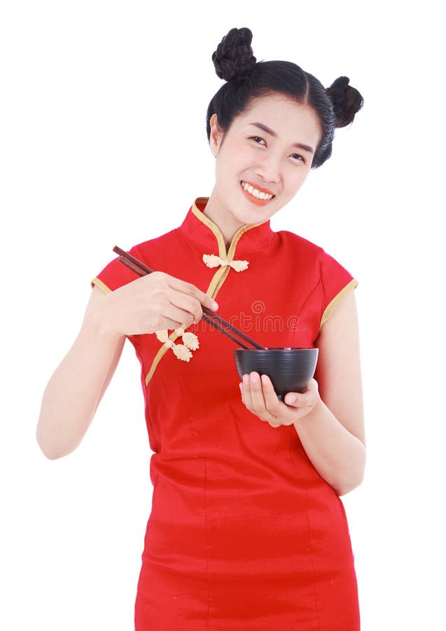 Happy woman wearing chinese cheongsam dress with chopsticks and royalty free stock photography Happy woman wearing chinese cheongsam dress with chopsticks and royalty free stock photography