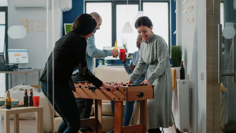 Happy Women Playing Game at Foosball Table after Work Stock Image ...