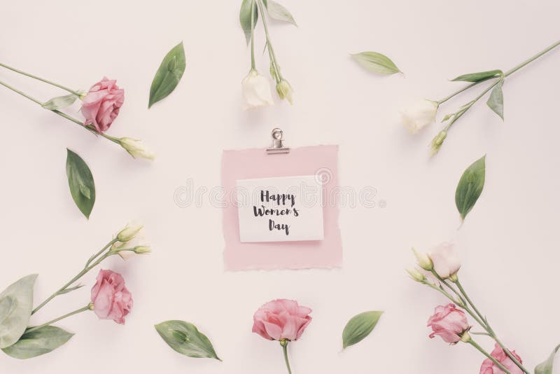 happy womens day inscription with rose flowers. High quality photo