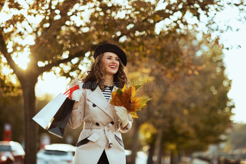 Happy 40 Years Old Woman with Shopping Bags and Autumn Leaves Stock ...