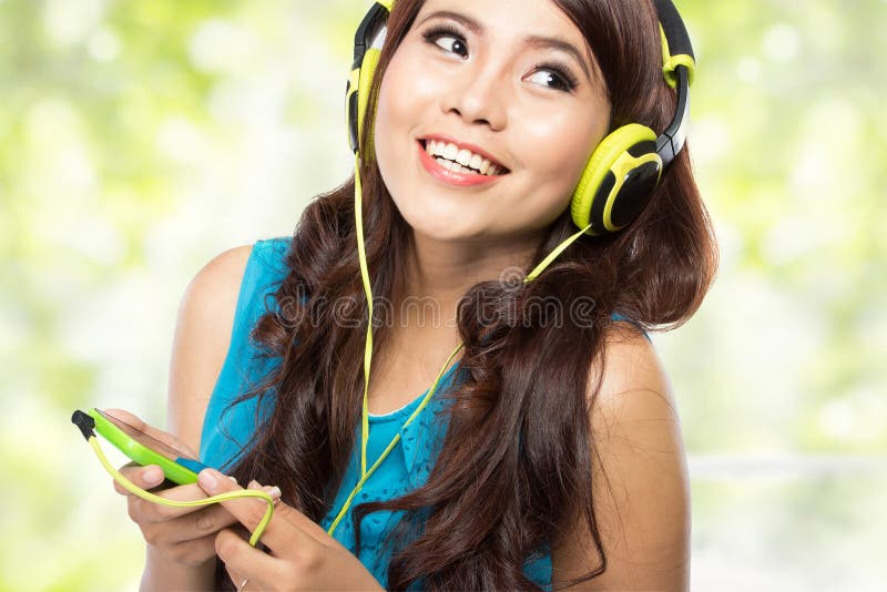 Happy Young asian girl with headphones