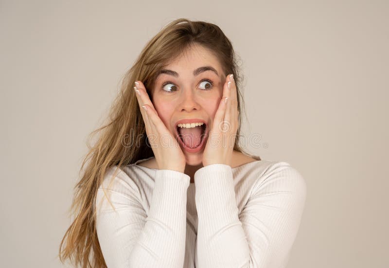 Happy Young Attractive Teenager Girl Shocked with Surprised Funny Face