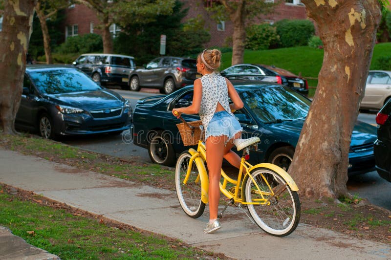 Happy young bicyclist riding in city. stock photo Happy young bicyclist riding in city. stock photo